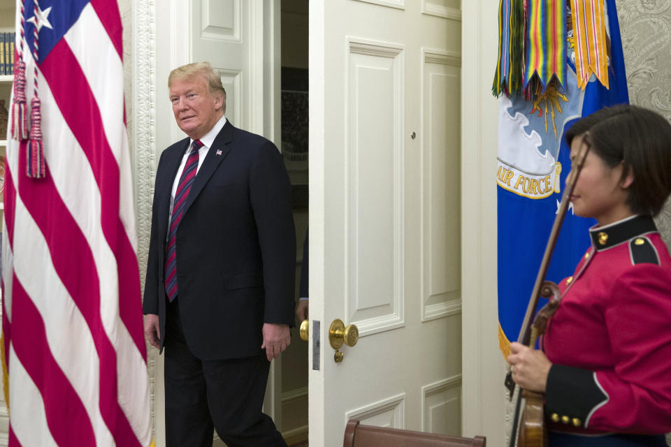 President Donald Trump arrives for a naturalization ceremony in the Oval Office of the White House, in Washington, Saturday, Jan. 19, 2019. (AP Photo/Alex Brandon)