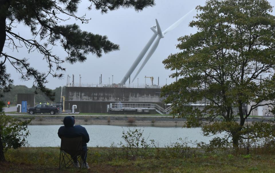 A neighbor, who wished to be unnamed and lives 800 feet from Falmouth's Wind 2 turbine, brought along a cell phone to document the turbine's demolition on Wednesday in West Falmouth. The structure was brought down precisely at 10 a.m. in a slow, 14-second fall by Atlantic Coast Dismantling, based in Saugus.