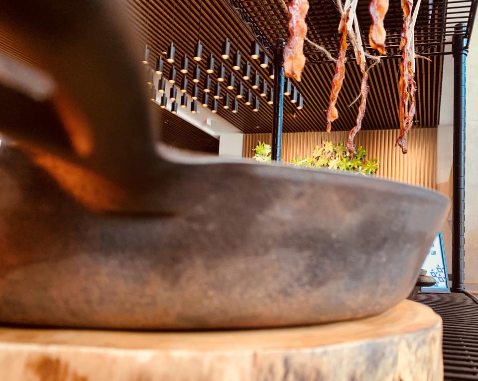 Crisp bacon hangs from twine at the bacon station for brunch at Park Street Kitchen & Bar inside the Hilton Des Moines Downtown for Mother's Day.