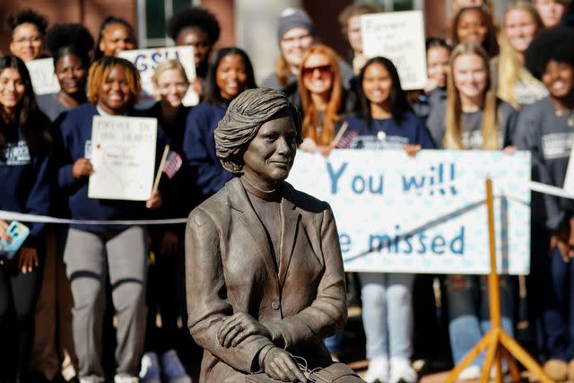 <p>JOHN BAZEMORE/POOL/AFP via Getty</p> Students watch as Carter family members participate in a wreath-laying ceremony to honor former first lady Rosalynn Carter at Georgia Southwestern State University on Nov. 27