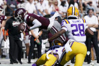 Mississippi State wide receiver Malik Heath (4) fumbles as he is upended by LSU cornerback Cordale Flott (25) during the first half of an NCAA college football game, Saturday, Sept. 25, 2021, in Starkville, Miss. (AP Photo/Rogelio V. Solis)