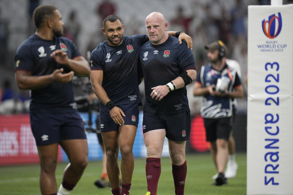 England's Dan Cole, right, and England's Joe Marchant react after the Rugby World Cup Pool D match between England and Argentina in the Stade de Marseille, Marseille, France Saturday, Sept. 9, 2023. England won the match 27-10. (AP Photo/Daniel Cole)