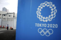 A security guard stands guard at one of the venues for the Tokyo 2020 Olympic Games in Tokyo, Tuesday, May 12, 2020. Japan is still under a coronavirus state of emergency, which was extended this week until the end of May, though there have been no hard lockdowns. (AP Photo/Eugene Hoshiko)