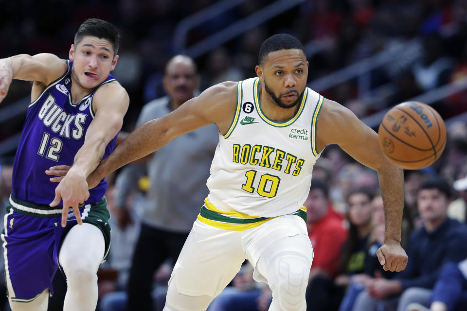 Houston Rockets guard Eric Gordon (10) chases a loose ball in front of Milwaukee Bucks guard Grayson Allen (12) during the second half of an NBA basketball game Sunday, Dec. 11, 2022, in Houston. (AP Photo/Michael Wyke)