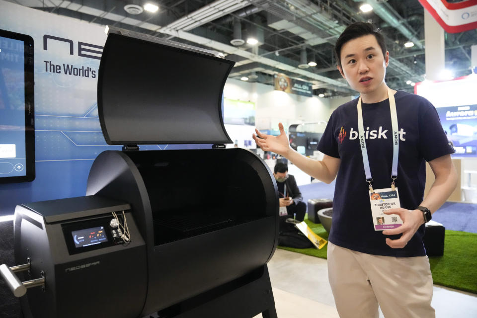 Christopher Huang, BriskIt, speaks on the company's newly unveiled NeoSear smart grill, that utilizes AI to generate recipes and monitor cooking during the CES tech show Wednesday, Jan. 10, 2024, in Las Vegas. (AP Photo/Ryan Sun)
