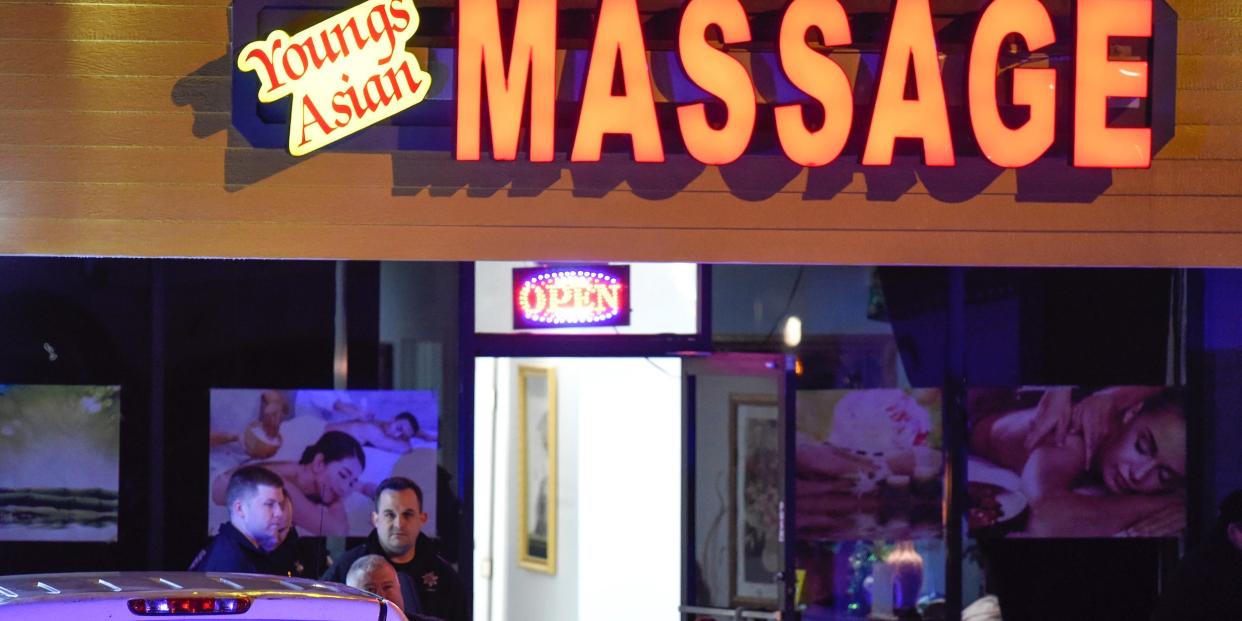 Authorities investigate a fatal shooting at a massage parlor, late Tuesday, March 16, 2021, in Acworth, Ga. Officials say 21-year-old Robert Aaron Long, of Woodstock, Georgia, has been captured hours after multiple people were killed in shootings at three Atlanta-area massage parlors.