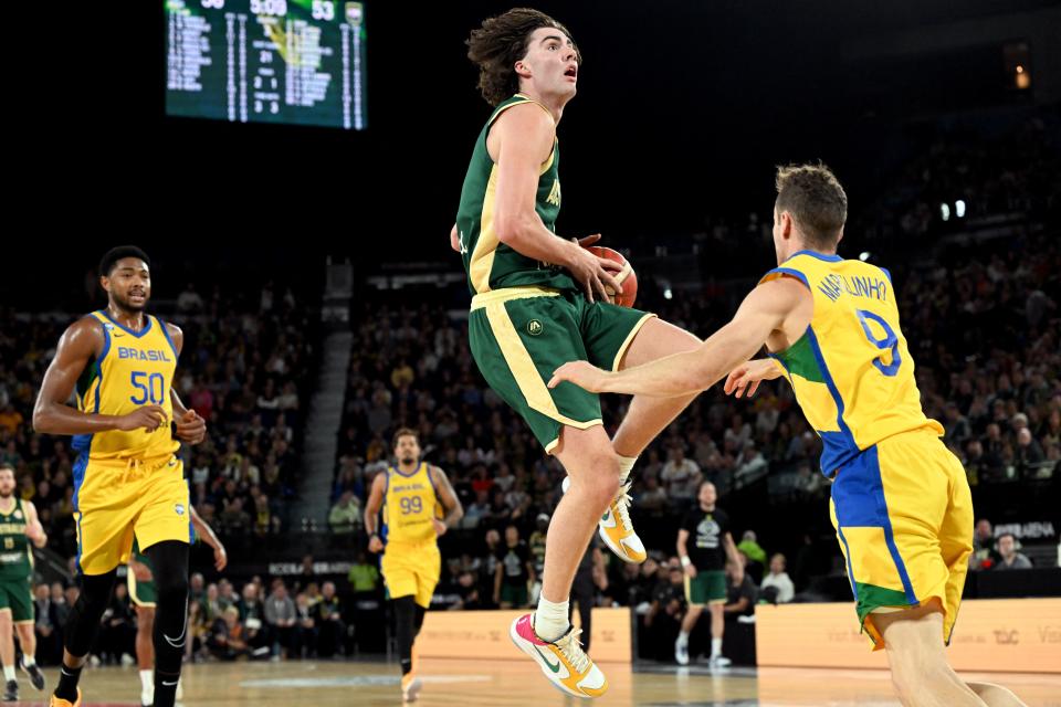 Australia’s Josh Giddey (C) lays up during the international friendly basketball match between Australia and Brazil in Melbourne on August 16, 2023, in preparation for the 2023 Philippines-Japan-Indonesia FIBA Basketball World Cup. (Photo by William WEST / AFP) / –IMAGE RESTRICTED TO EDITORIAL USE – STRICTLY NO COMMERCIAL USE– (Photo by WILLIAM WEST/AFP via Getty Images)