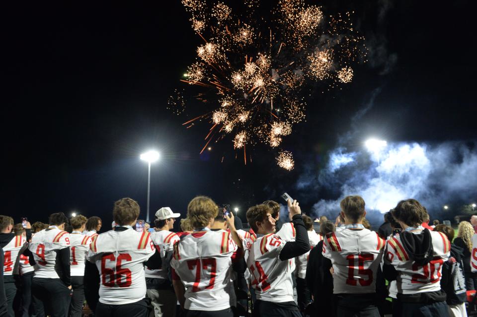Cardinal Mooney players watch a fireworks display during the celebration.