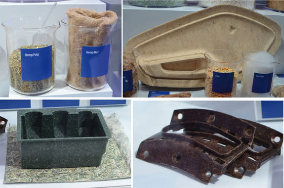 A display of futuristic materials by Ford. These are composite materials derived from renewable plant-based sources. Clockwise from top left: hemp fibers and pulp, kenaf fiber reinforced door inner panel and corn fibers in a beaker, shredded U.