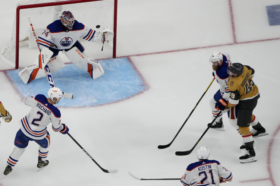 Vegas Golden Knights center Ivan Barbashev, right, scores against Edmonton Oilers goaltender Stuart Skinner (74) during the third period of Game 2 of an NHL hockey Stanley Cup second-round playoff series Saturday, May 6, 2023, in Las Vegas. (AP Photo/John Locher)