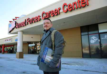 Nicholas Bade, 37, who is among the transgender Americans who this month can enlist openly in the U.S. military for the first time after courts blocked President Donald TrumpÕs effort to re-establish a ban on transgender service members, poses outside a recruitment center in Chicago, Illinois, U.S., January, 4, 2018. Photo taken January 4, 2018. REUTERS/Chris Kenning