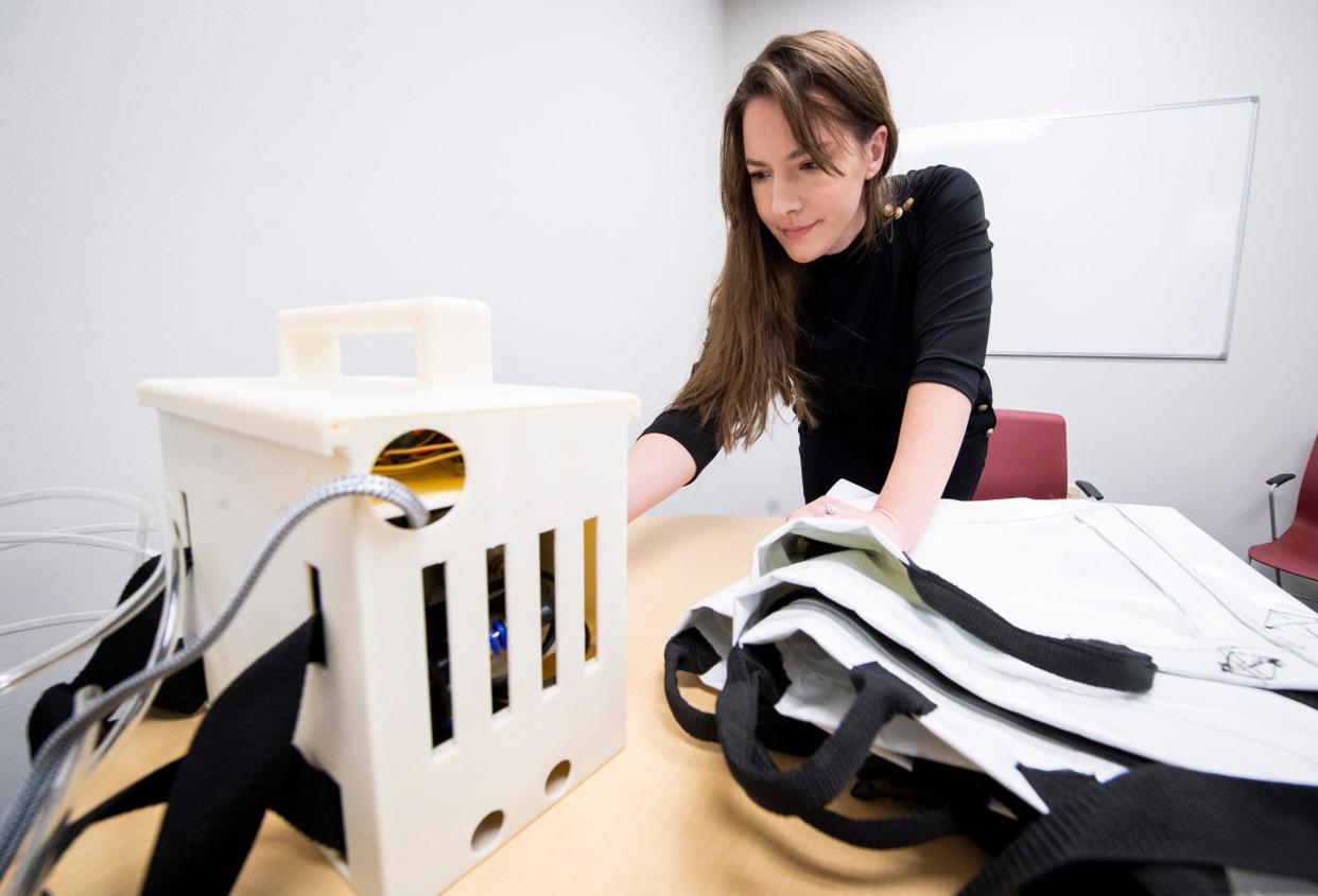 Morgan Miller goes through the options on the Morganleigh, a medical device that assists in moving bedridden patients, on Wednesday, Feb 8, 2023.