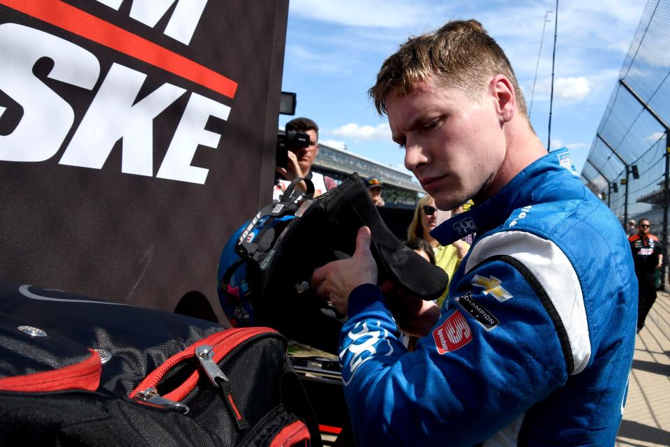 Team Penske driver Josef Newgarden (2) stands by his pit box Friday, July 29, 2022, during practice for the Gallagher Grand Prix at Indianapolis Motor Speedway.