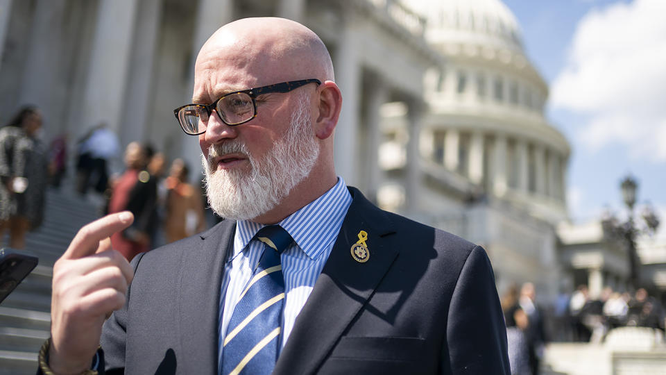 Rep. Derrick Van Orden (R-Wis.) speaks to reporters outside the House Chamber following a series of votes on April 10, 2024.