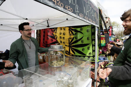 A vendor sells marijuana during the annual 4/20 marijuana event at Sunset Beach in Vancouver, British Columbia, Canada April 20, 2017. REUTERS/Jason Redmond