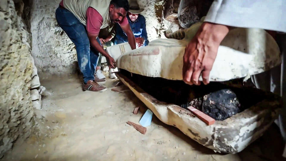 A 3,000-year-old coffin is opened in a burial chamber at the Saqqara in Giza site near Cairo. (TODAY)