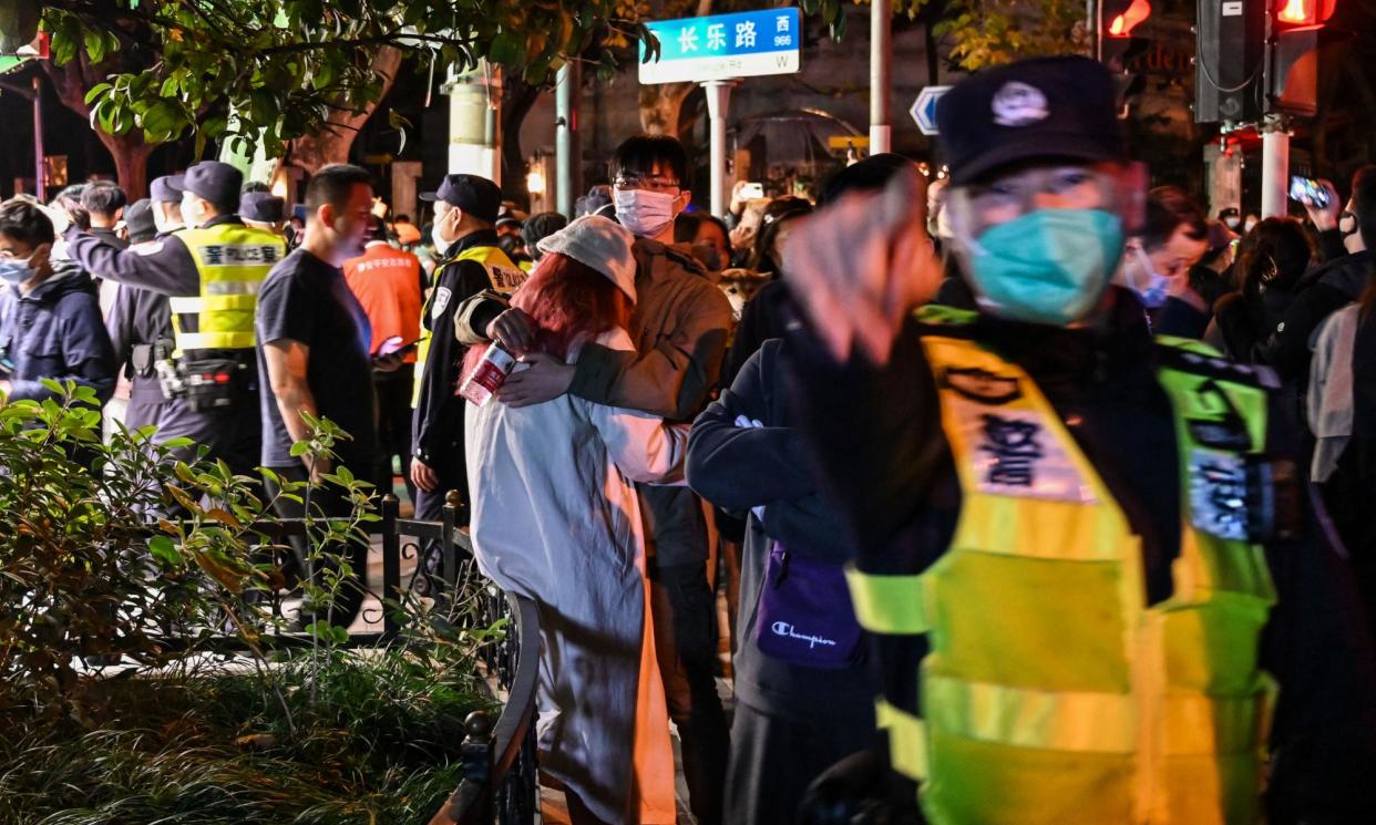 <span>Police in Shanghai move to disperse the first night of ‘white paper’ protests in November 2022.</span><span>Photograph: Héctor Retamal/AFP/Getty Images</span>