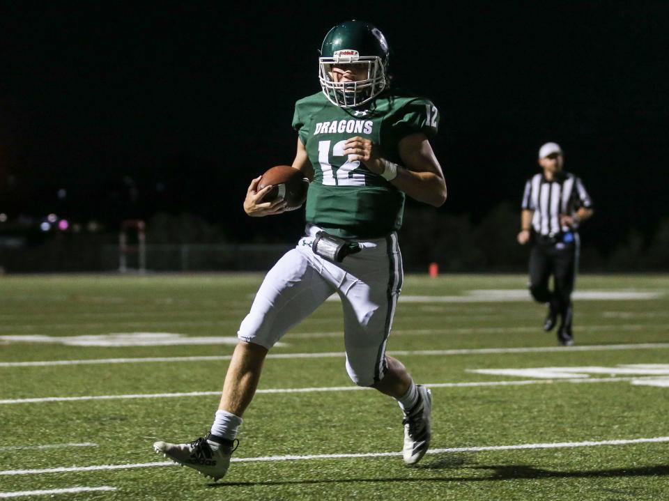 QB Nick Hamilton runs for yardage during South Oldham's win over Atherton on Sept. 30, 2022 at South Oldham High School.