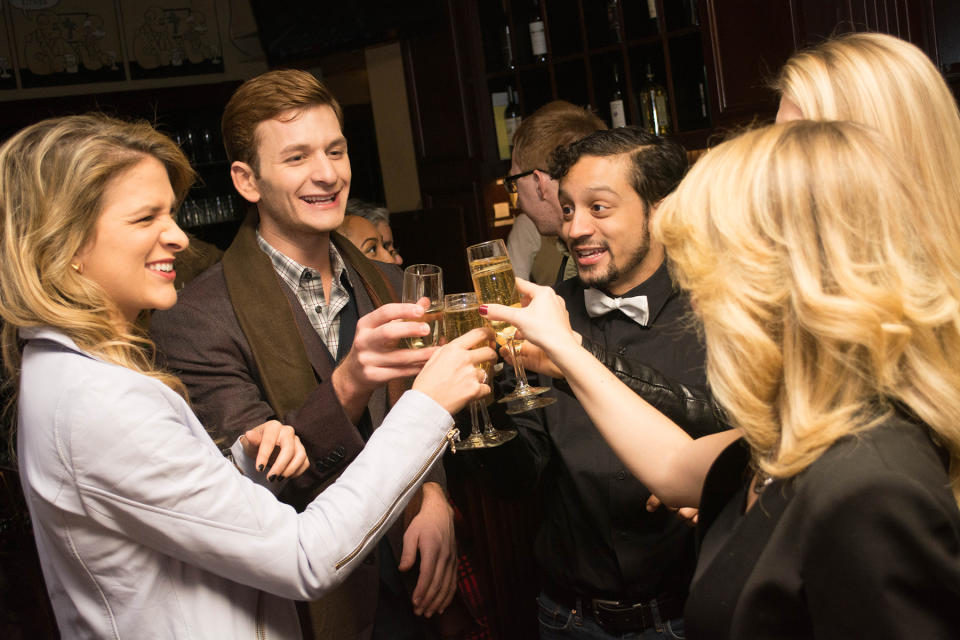 Green, Falduto, and Infante share a toast at a recent event.