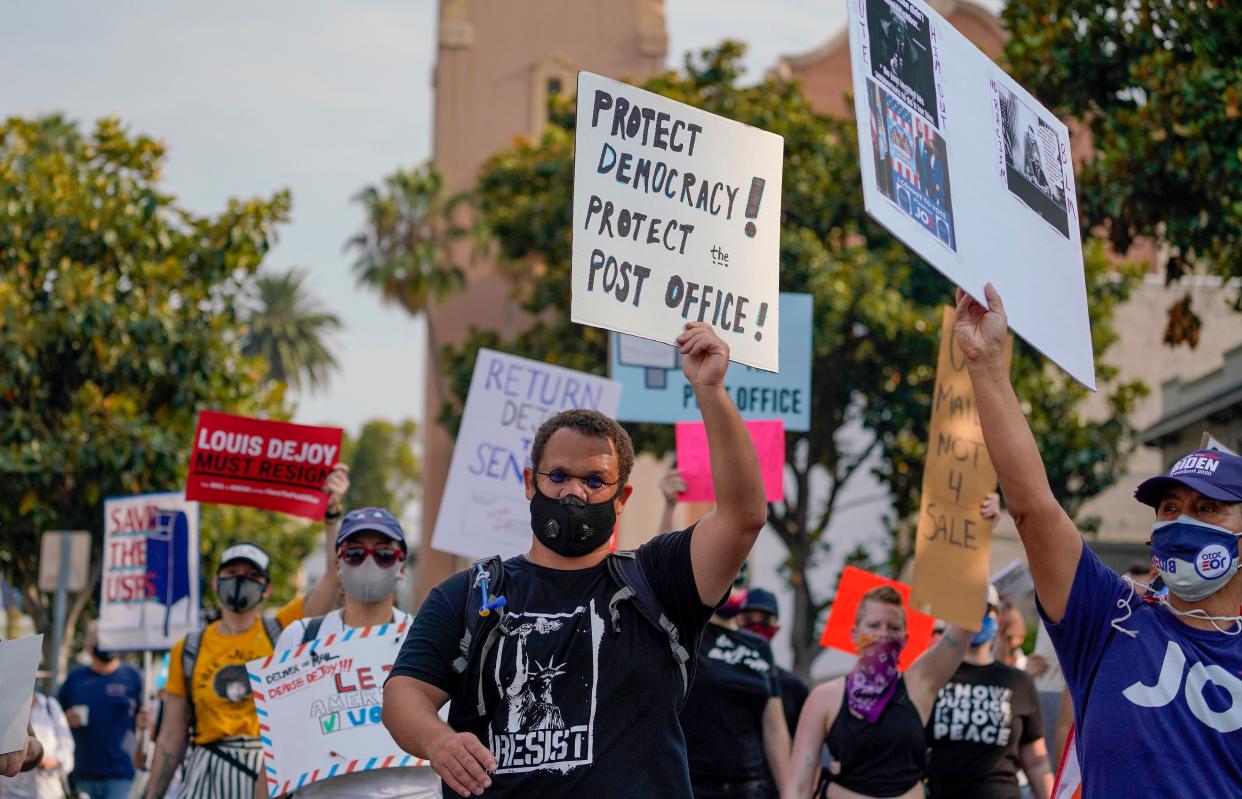 Protesters hold a "Save the Post Office" demonstration outside a United States Postal Service location in Los Angeles, California, on August 22, 2020. (Kyle Grillot/AFP via Getty Images)