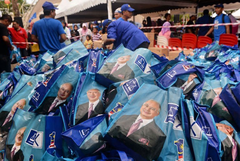 Barisan National Party gift bags are piled up during Malaysian Prime Minister Najib Razak's meeting with parliamentary constituency young voters at his hometown in Pekan on May 4, 2013