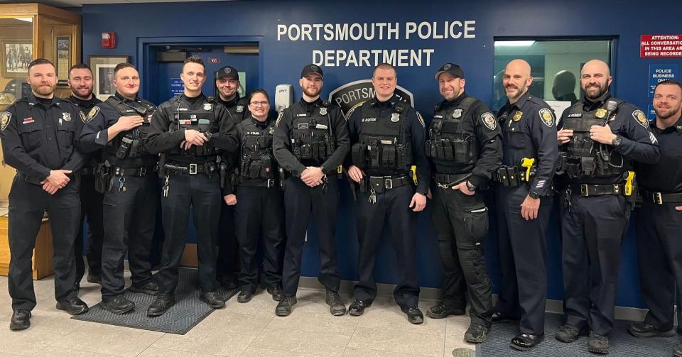 From left to right in the lobby of the Portsmouth Police Department are officers Tim Conroy, Zach Brandt, Michael Nicoli, Daniel Cattani, Josh Haile, Sarah Kotz, Kevin Cardno, Benjamin Ashton,
K9 Officer Bill Werner and Lt. Seth Tondreault, Sgt. Max Webber and Sgt. Matthew Young.