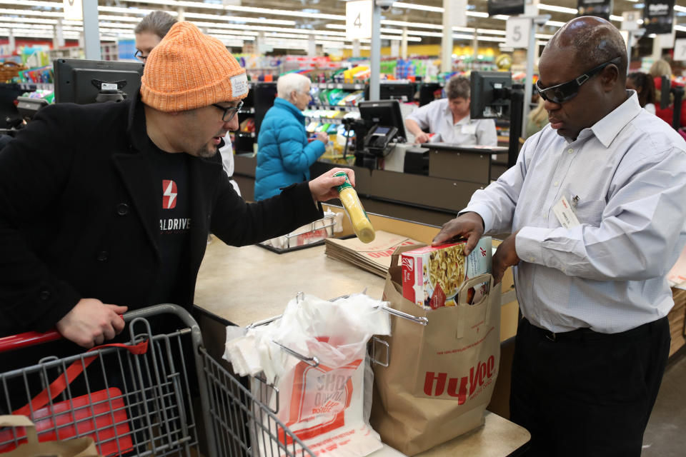 James Sloan an employee at Hy-Vee bagged grocery for a customer Scott Ware Thursday Feb 22 2018 in New Hope, MN.]  Sloan is blind and has been an employee at the store since 2015 JERRY HOLT ‚Ä¢ jerry.holt@startribune.com (Photo By Jerry Holt/Star Tribune via Getty Images)