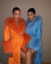 <p>Always loving a neon moment, Stassie and Kylie wore matching patent leather trench coats with dramatic fur accents, with Stassie in a vibrant tangerine hue and Kylie in a sky blue. </p>