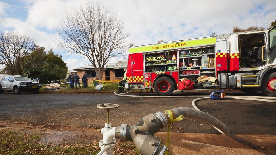 Emergency services were called to the home on Pimpala Place about 5.45am, and found the building well-alight. Picture: NCA NewsWire/Graham Schumann