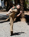 Chinese national Jack Wang, a security trainer at the Chinese-run Deway Security Group leads Kenyan security guards in martial arts combat training at their company compound in Kenya's capital Nairobi, March 13, 2017. REUTERS/Thomas Mukoya