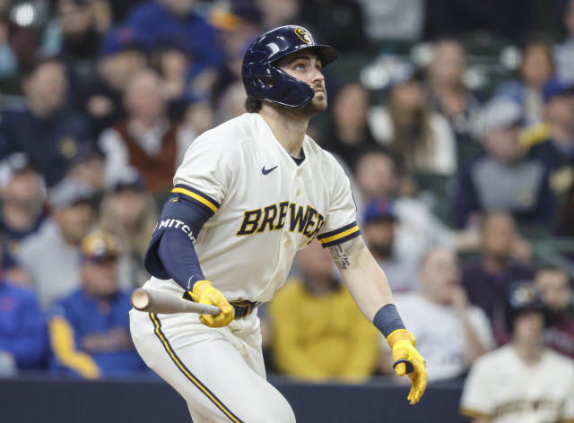 Milwaukee Brewers' Garrett Mitchell reacts after getting his first