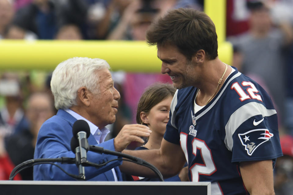Former New England Patriots quarterback Tom Brady, right, embraces Patriots owner Robert Kraft, left, during halftime ceremonies held to honor Brady at an NFL football game between the Philadelphia Eagles and the Patriots, Sunday, Sept. 10, 2023, in Foxborough, Mass. (AP Photo/Mark Stockwell)