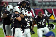 Arizona Cardinals kicker Zane Gonzalez (5) celebrates his game-winning field goal with teammates after an NFL football game against the Seattle Seahawks, Sunday, Oct. 25, 2020, in Glendale, Ariz. The Cardinals won 37-34 in overtime. (AP Photo/Rick Scuteri)