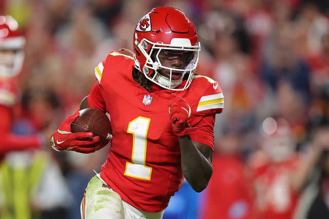 <p>David Eulitt/Getty</p> Xavier Worthy #1 of the Kansas City Chiefs rushes for a touchdown during the fourth quarter against the New Orleans Saints at GEHA Field at Arrowhead Stadium on October 07, 2024