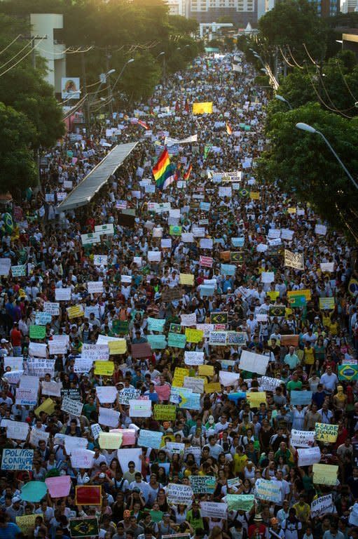 Thousands of people march on Avenida Conde Boa Vista, in the center of Recife, state of Pernambuco, Brazil, on June 20, 2013. Hundreds of thousands of people rallied across Brazil, as a protest movement over the quality of public services and the high cost of staging the World Cup gathered steam