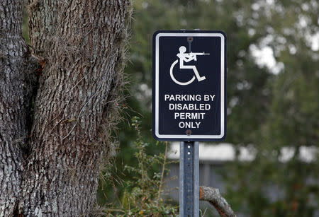 A unique handicapped parking sign outside Spike's Tactical LLC, a gunmaker in Apopka, Florida, U.S. December 10, 2018. Picture taken December 10, 2018. REUTERS/Gregg Newton