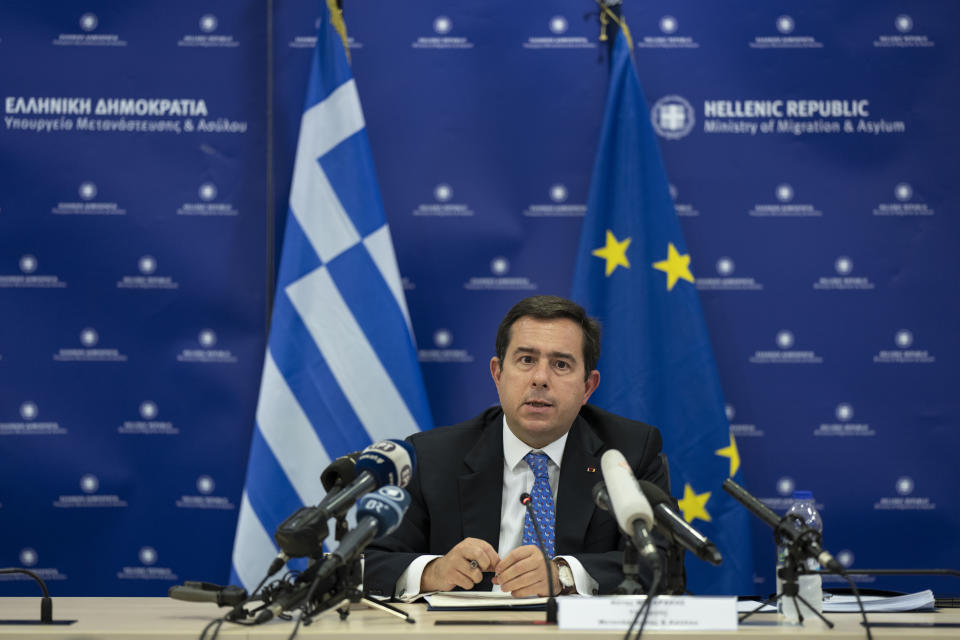 Greek Migration Minister Notis Mitarachi speaks to reporters during a news conference in Athens on Monday, Sept. 26, 2022. Mitarachi says Greece still considers neighbor Turkey to be a safe country for refugees despite recent allegations by the Greek government that Ankara has 'weaponized' migration for political purposes. (AP Photo/Petros Giannakouris)