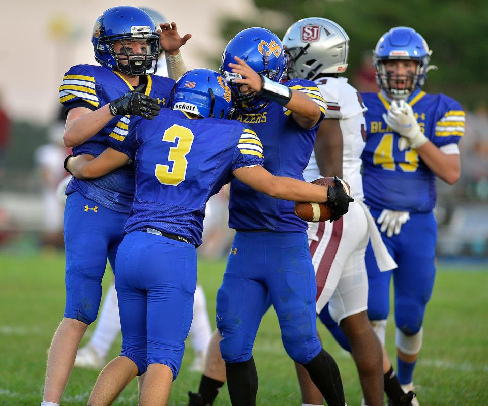 Clear Spring players react after scoring a touchdown against Saint James in their 2021 season opener.