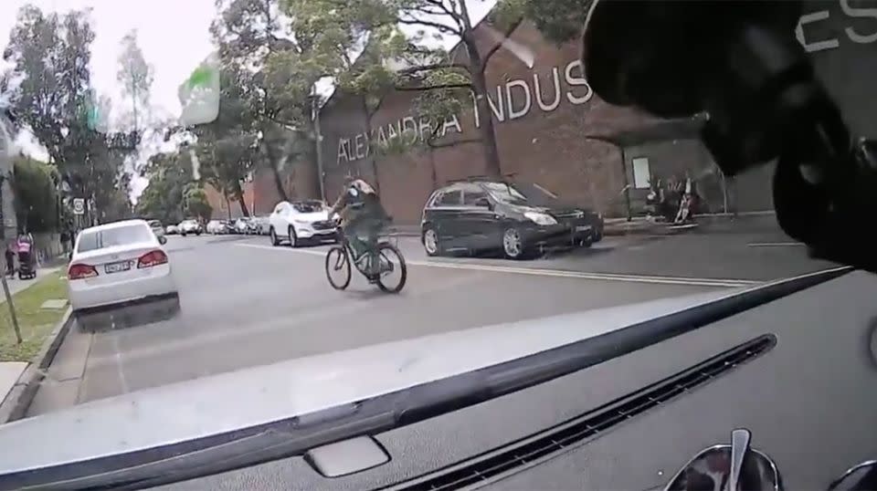 The cyclist jumped back on his bike and fled the scene. Source: Facebook / Dash Cam Owners Australia