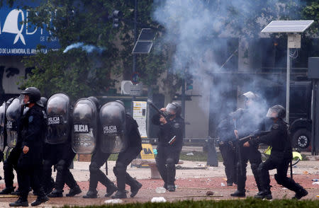 Riot policemen fire tear gas during clashes outside the Congress, where the budget bill is being debated, in Buenos Aires, Argentina October 24, 2018. REUTERS/Martin Acosta