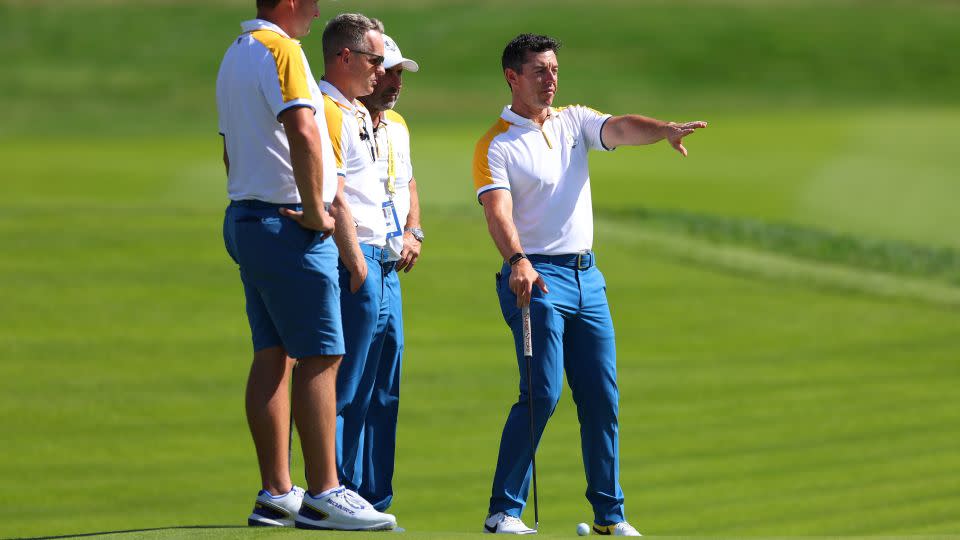 Rory McIlroy (right) makes his point to Donald (second from left) and other European teammates. - Andrew Redington/Getty Images