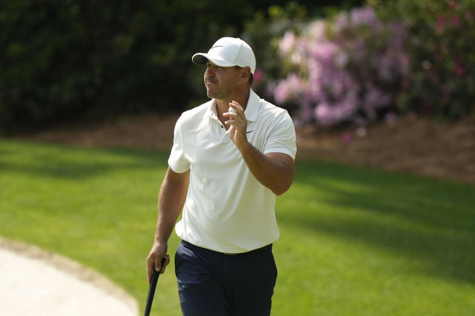 Brooks Koepka waves after his putt on the 13th hole during the second round of the Masters golf tournament at Augusta National Golf Club on Friday, April 7, 2023, in Augusta, Ga. (AP Photo/Charlie Riedel)