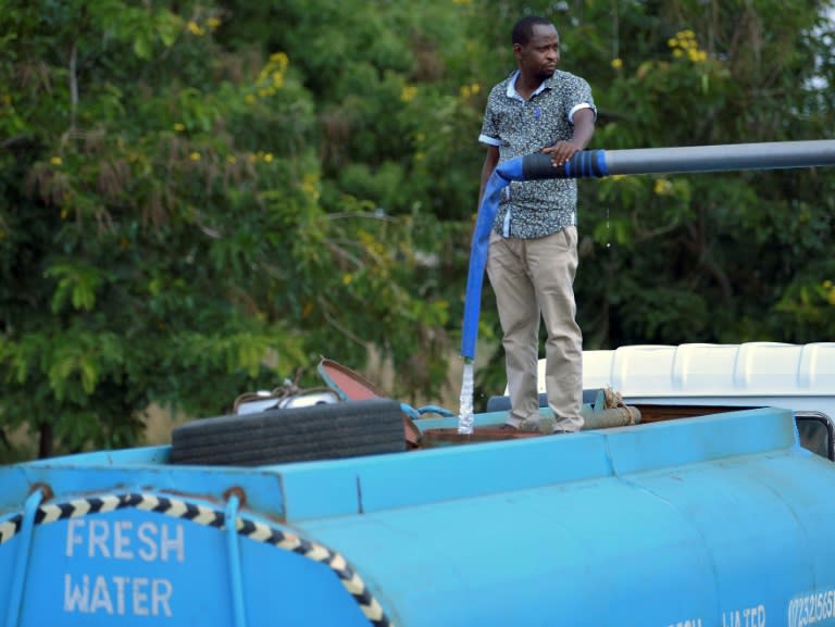 Patrick Kilonzo fills a hired bowser water tanker before embarking on a 70-kilometre journey to deliver the water to thirsty wildlife in the Tsavo West National Park in Kenya, on February 24, 2017