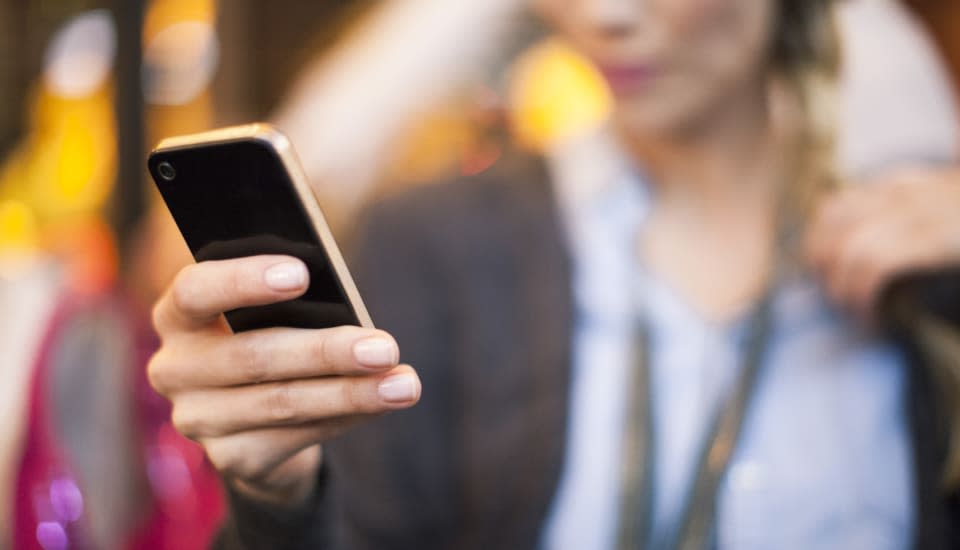 Woman taking selfie with smartphone