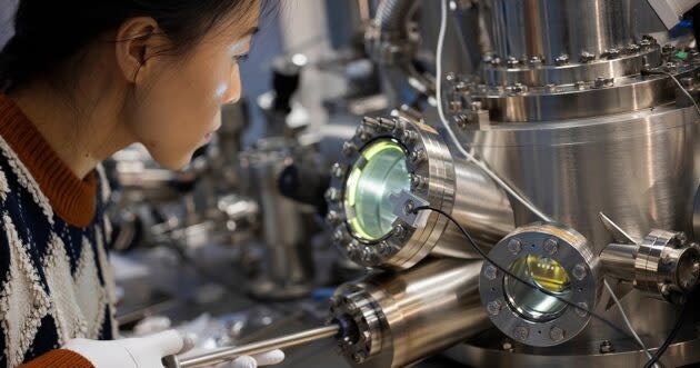 Postdoctoral researcher Xiaojing Zhao works in Microsoft’s Quantum Materials Lab, where an important milestone towards creating a topological qubit and scalable quantum computer has been demonstrated. (Photo by John Brecher for Microsoft)