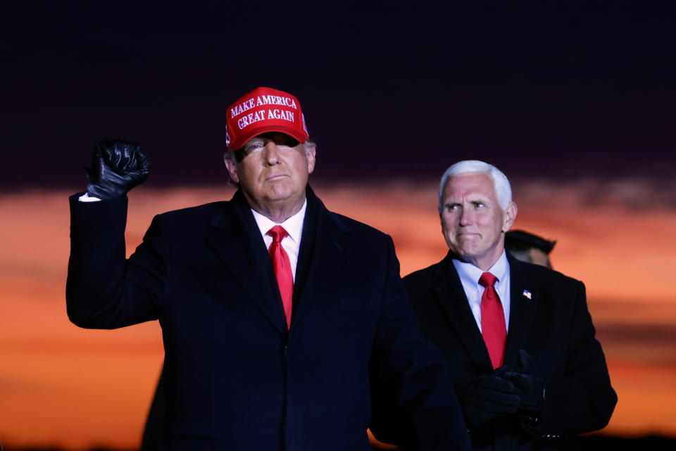 U.S. President Donald Trump and Vice President Mike Pence attend a campaign rally at Cherry Capital Airport in Traverse City, Michigan, U.S., November 2, 2020. REUTERS/Carlos Barria