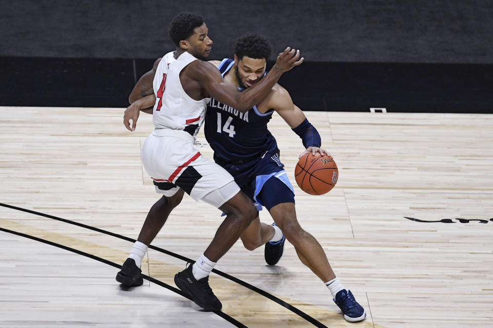 Hartford's Moses Flowers fouls Villanova's Caleb Daniels during the second half of an NCAA college basketball game, Tuesday, Dec. 1, 2020, in Uncasville, Conn. (AP Photo/Jessica Hill)
