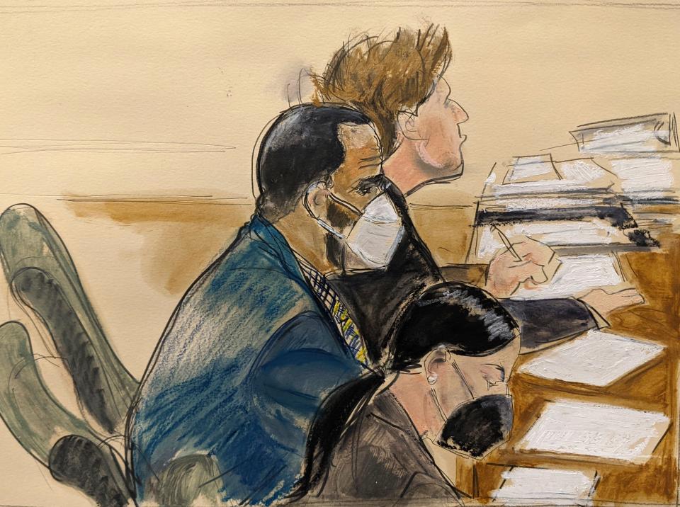 In this courtroom artist's sketch, R. Kelly, center, listens during his trial in New York on Aug. 26, 2021.