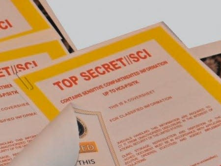 Close up of documents recovered at Mar-a-Lago with "TOP SECRET" cover sheets.