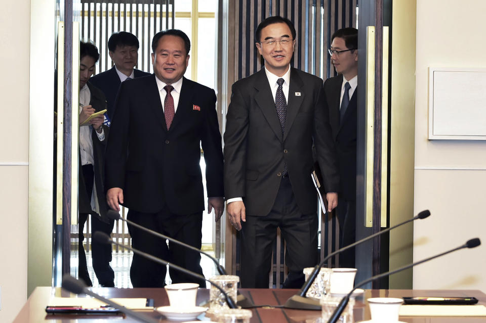 South Korean Unification Minister Cho Myoung-gyon, right, and his North Korean counterpart Ri Son Gwon arrive to hold their meeting at the southern side of Panmunjom in the Demilitarized Zone, South Korea, Monday, Oct. 15, 2018. The rival Koreas are holding high-level talks Monday to discuss further engagement amid a global diplomatic push to resolve the nuclear standoff with North Korea. (Korea Pool via AP)